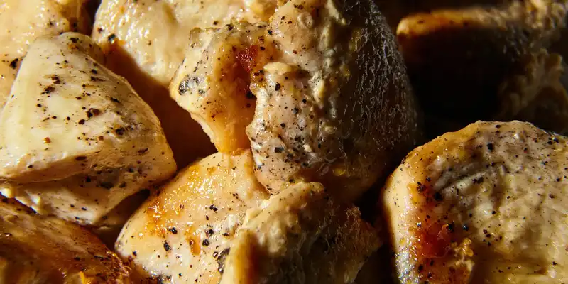 Cooked turkey back (meat and skin)
